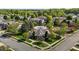 Aerial view of a community clubhouse featuring a well-manicured lawn and meticulous landscaping at 638 Village Lake Dr, Mebane, NC 27302