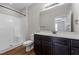 Bathroom featuring a walk-in shower, a toilet, and a vanity with cabinets for plenty of storage at 638 Village Lake Dr, Mebane, NC 27302