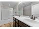 This bathroom features a double sink, a walk-in shower and tub combo, and plenty of light at 638 Village Lake Dr, Mebane, NC 27302