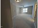 Bedroom with neutral carpet and a window providing natural light at 638 Village Lake Dr, Mebane, NC 27302