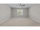 Bedroom featuring a ceiling fan, neutral carpeting, and window with blinds for a comfortable atmosphere at 638 Village Lake Dr, Mebane, NC 27302