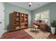 Inviting bedroom featuring a window, wood floors, ceiling fan, desk and chair at 638 Village Lake Dr, Mebane, NC 27302