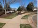 Scenic community walkway with mature trees and landscaping on a sunny day at 638 Village Lake Dr, Mebane, NC 27302