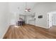 Open dining room with hardwood floors, a chandelier, and adjacent kitchen bar at 638 Village Lake Dr, Mebane, NC 27302