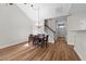 Dining room with high ceilings, wood floors, chandelier, and table with seating for six at 638 Village Lake Dr, Mebane, NC 27302
