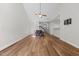 Bright dining room featuring hardwood floors, a chandelier, and kitchen bar at 638 Village Lake Dr, Mebane, NC 27302