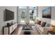 Cozy living room featuring hardwood floors, a television, and an exterior view through the glass door at 638 Village Lake Dr, Mebane, NC 27302