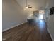 Open living room featuring hardwood floors, vaulted ceiling, and an open layout at 638 Village Lake Dr, Mebane, NC 27302