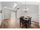 Open living space featuring high ceilings, a ceiling fan, and wood flooring, bathed in natural light at 638 Village Lake Dr, Mebane, NC 27302