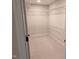 Walk-in closet featuring wire shelving and neutral carpet at 638 Village Lake Dr, Mebane, NC 27302