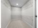 An empty walk-in closet featuring carpeted floors, wire shelving, and neutral paint, providing ample storage space at 638 Village Lake Dr, Mebane, NC 27302