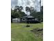 A single story home with a metal shed and an old truck in the front yard at 652 Old Sanford Rd, Moncure, NC 27559