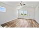 Bright bedroom featuring stylish wood floors, vaulted ceiling, and plenty of natural light at 962 Spring Hill Church Rd, Lillington, NC 27546