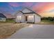 Charming single-story home with a well-manicured lawn and inviting front porch at 962 Spring Hill Church Rd, Lillington, NC 27546