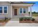 Inviting covered porch with classic columns and a well-maintained entryway at 962 Spring Hill Church Rd, Lillington, NC 27546
