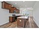 Bright kitchen features stainless steel appliances, dark cabinets, white countertops, and wood-look flooring at 962 Spring Hill Church Rd, Lillington, NC 27546
