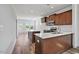 Stylish kitchen with rich wood cabinets, modern appliances, and island at 962 Spring Hill Church Rd, Lillington, NC 27546