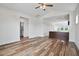 Bright living space with modern wood floors and open view to kitchen and bath at 962 Spring Hill Church Rd, Lillington, NC 27546