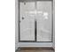 Modern shower features white tile and sleek glass doors at 962 Spring Hill Church Rd, Lillington, NC 27546