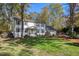 Traditional two-story home features a lush green lawn and mature trees at 100 Queensferry Rd, Cary, NC 27511