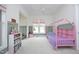 Bright bedroom features an open floorplan with a charming pink playhouse bed at 1005 Whistler St, Durham, NC 27713