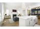 Bright, open living space with a fireplace, an adjacent kitchen island, and seamless transition to the dining area at 1005 Whistler St, Durham, NC 27713