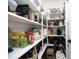 Well-stocked pantry with ample shelving, providing plenty of storage for food and household items at 1005 Whistler St, Durham, NC 27713