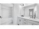 Modern bathroom with double vanity, sleek fixtures, and a separate shower and tub at 101 Hiddenite Pl, Holly Springs, NC 27540
