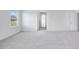 Carpeted bedroom featuring one window, a closet door, and an open doorway to the hallway at 101 Hiddenite Pl, Holly Springs, NC 27540