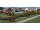 Community pool with shade structures, a black fence, and a walking path to the recreational area at 101 Hiddenite Pl, Holly Springs, NC 27540