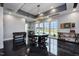 Well-lit game room complete with foosball table, dart board, and comfortable seating at 101 Hiddenite Pl, Holly Springs, NC 27540