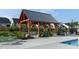 Community pool area features a shaded pavilion with outdoor seating and a lounge area at 101 Hiddenite Pl, Holly Springs, NC 27540
