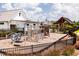 Community playground with modern play equipment and covered pavillion for outdoor activities at 101 Hiddenite Pl, Holly Springs, NC 27540