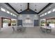 Relaxing outdoor lounge by the pool featuring a wet bar and ample seating at 101 Hiddenite Pl, Holly Springs, NC 27540