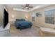 Comfortable bedroom features a ceiling fan, a queen size bed and neutral colored walls at 1018 Tranquil Creek Way, Wake Forest, NC 27587