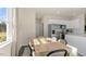Eat-in dining area with natural light and modern furnishings adjacent to the kitchen at 102 Saddle Mare St, Clayton, NC 27520