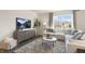 Cozy living room with a comfortable sectional sofa, stylish decor, and a scenic view at 102 Saddle Mare St, Clayton, NC 27520