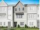Charming townhouse with light gray and white exterior, manicured lawn, and welcoming entrance at 1026 Zelkova Lane, Chapel Hill, NC 27517