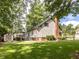 Serene backyard with a spacious lawn, shed, and patio, perfect for outdoor activities and relaxation at 104 Pinecroft Dr, Raleigh, NC 27609
