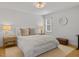 Bright bedroom with a neutral color scheme and a decorative light fixture at 104 Pinecroft Dr, Raleigh, NC 27609