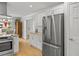 Modern kitchen with stainless steel appliances, light wood floors and an open design at 104 Pinecroft Dr, Raleigh, NC 27609