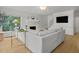 Bright living room boasts hardwood floors, fireplace, and lots of natural light at 104 Pinecroft Dr, Raleigh, NC 27609