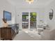 Cozy seating area with large sliding glass doors that lead out to a back deck at 104 Pinecroft Dr, Raleigh, NC 27609