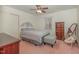 Bedroom with pink carpet, window views, and furnishings for comfortable living at 1103 Driftwood Dr, Siler City, NC 27344