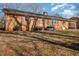 A brick house with a well-maintained yard and a visible air conditioning unit sits on a sunny day at 1103 Driftwood Dr, Siler City, NC 27344
