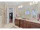 Bathroom with dual sinks and walk in shower at 113 Hardy Oaks Way, Holly Springs, NC 27540