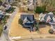 Aerial view of a charming neighborhood showcasing single-Gathering homes, mature trees and well-kept lawns at 114 Lansbrooke Ln, Apex, NC 27502