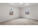 Bright bedroom featuring carpet and two windows offering natural light at 120 King Charles Rd, Hillsborough, NC 27278