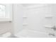 Bright, white bathroom with tub and shower combination, and a window at 132 Ambergate Ct, Rocky Mount, NC 27804