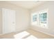 Bright bedroom with neutral carpeting, large windows, and ample natural light at 132 Ambergate Ct, Rocky Mount, NC 27804